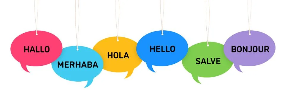 Paper speech bubbles with greetings in different languages hanging on white.. Stock Photos