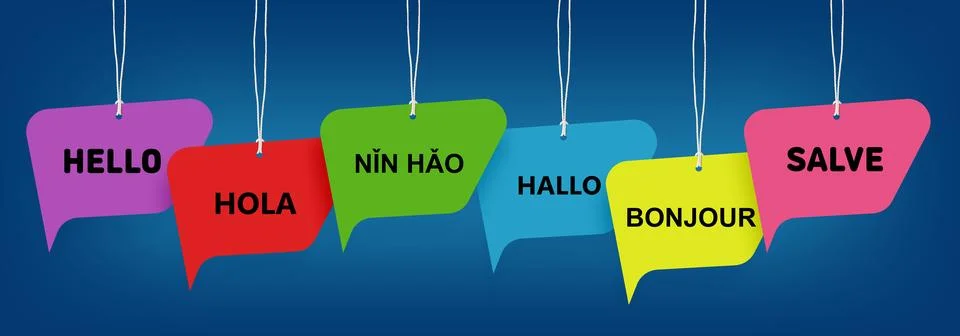 Paper speech bubbles with greetings in different languages hanging on dark .. Stock Photos