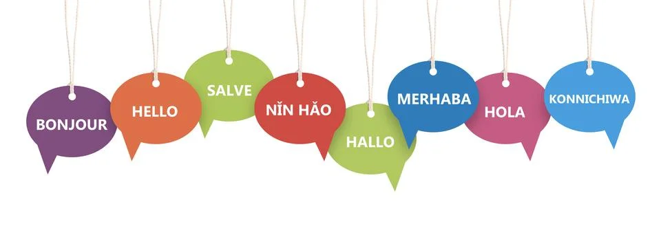 Paper speech bubbles with greetings in different languages hanging on white.. Stock Photos