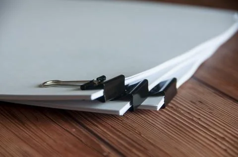 Paper stack of pile of documents on wooden desk. Copy space and business Stock Photos
