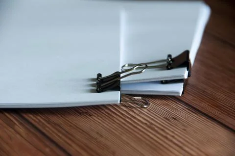 Paper stack of pile of documents on wooden desk. Copy space and business Stock Photos