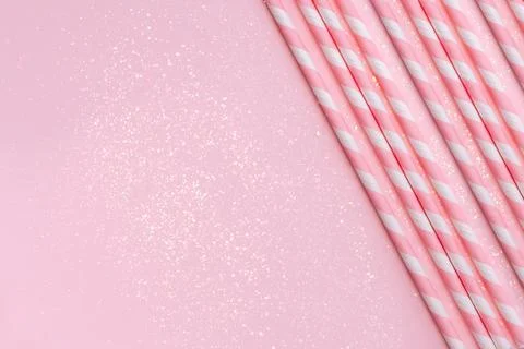 Paper straws on background with sparkles Stock Photos