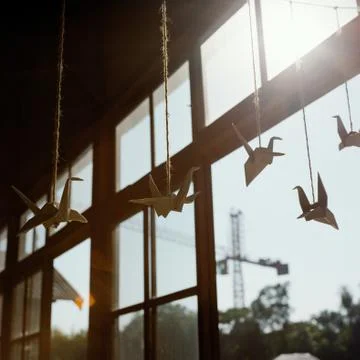 Paper swans on strings Stock Photos