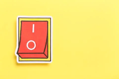 Paper switch button on yellow background. Start concept Stock Photos