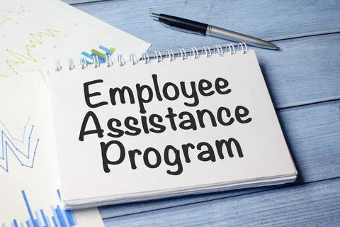 Paper with the text EAP Employee Assistance Program on blue wooden backgrou.. Stock Photos