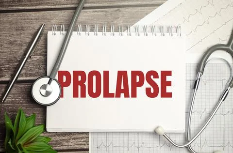 Paper text PROLAPSE , on a table with a stethoscope and pills, medical Stock Photos