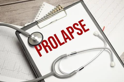 Paper text PROLAPSE , on a table with a stethoscope and pills, medical Stock Photos