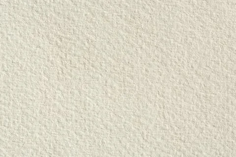 Paper texture background in light cream tone. Stock Photos
