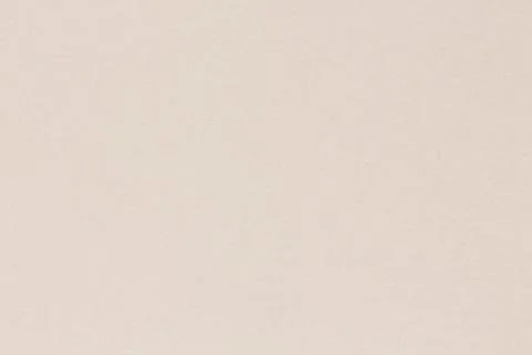 Paper texture background in light cream tone, macrp shot. Stock Photos