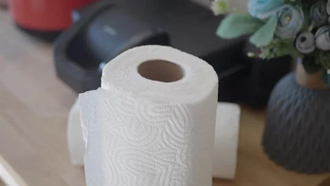 Paper towel roll on a table with flowers and a printer Video stock 312908787