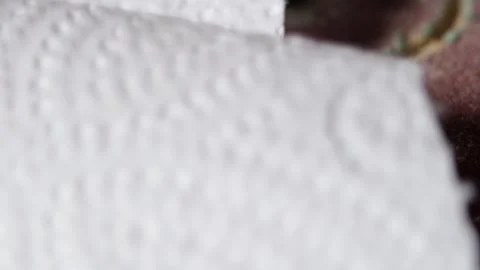 Paper towel torn along perforation embossed pattern crisp tearing sound hand Stock Footage 320897620