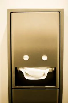 Paper towels dispenser looks like a smiley face Stock Photos