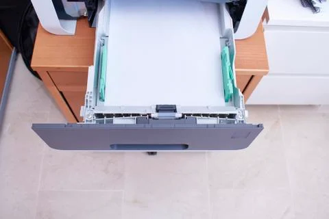 Paper tray of a printer in an office Stock Photos