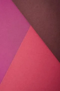 Paper triangle geometric texture in red, purple and brown colors Stock Photos