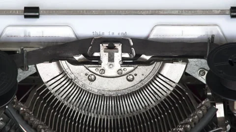 Paper with typed text THIS IS END being pulled out of vintage typewriter Stock Footage 185128605