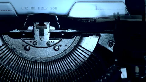 Paper with typed text LET ME HELP YOU being pulled out of typewriter at night Stock Footage 185127536