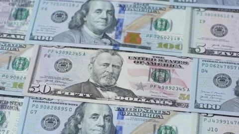 Paper US dollar bills of various denominations and cent coins as a business tool Stock Footage 338011870