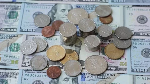 Paper US dollar bills of various denominations and cent coins as a business tool Stock Footage 338011879