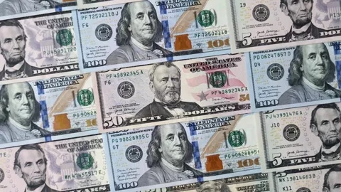 Paper US dollar bills of various denominations and cent coins as a business tool Stock Footage 338011934