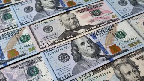 Paper US dollar bills of various denominations and cent coins as a business tool Stock Footage 338011957