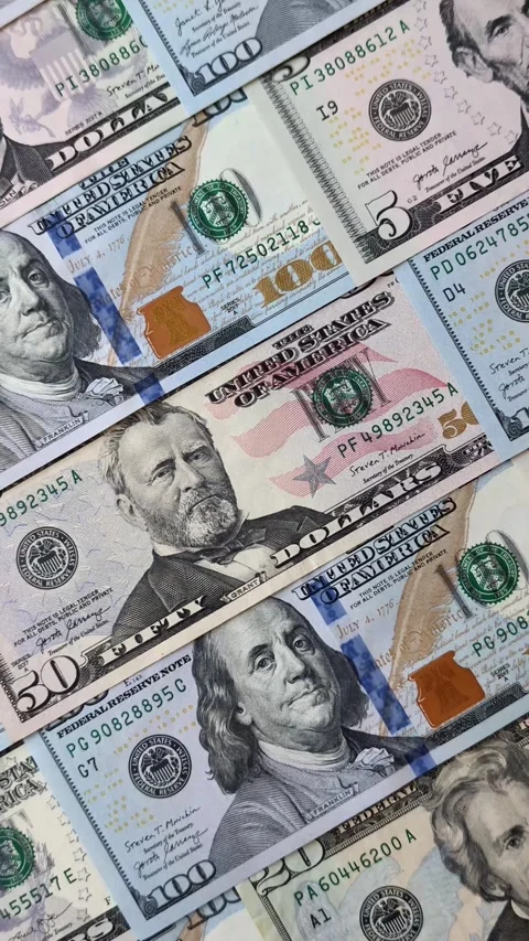 Paper US dollar bills of various denominations and cent coins as a business tool Stock Footage 338011963