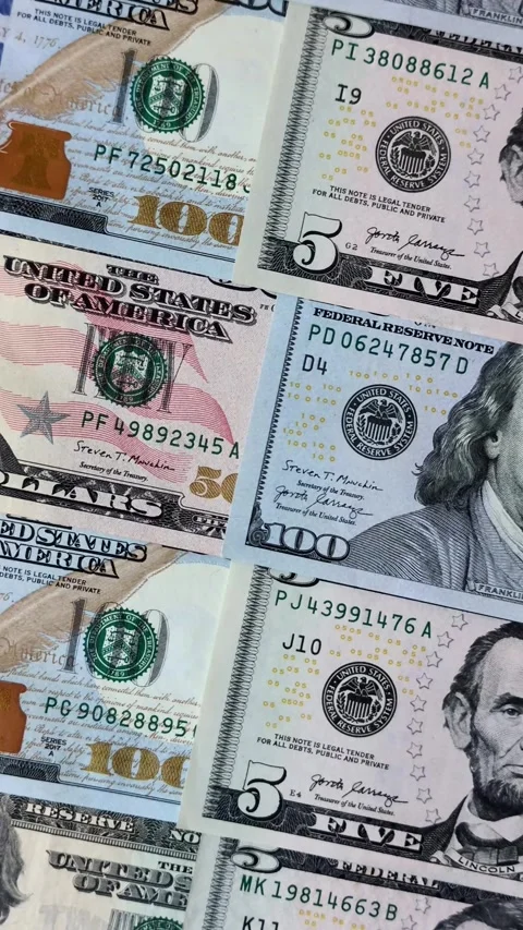 Paper US dollar bills of various denominations and cent coins as a business tool Stock Footage 338011971