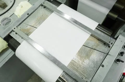 Paper web feeding and alignment unit in a roll rotary flexographic printing Stock Photos