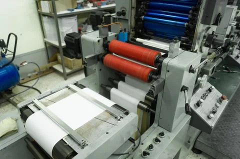 Paper web feeding and alignment unit in a roll rotary flexographic printing Stock Photos
