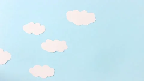 Paper white clouds made of paper float across the blue sky made of paper Stock Footage 161416440