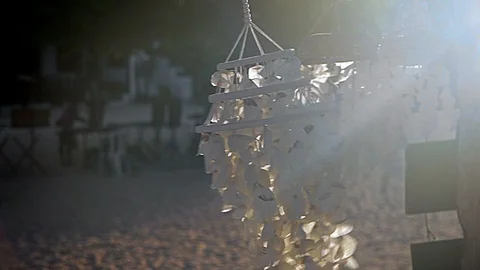 Paper wind chimes dancing in sun rays Vidéo 93520048