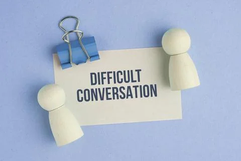 Paper with the word DIFFICULT CONVERSATION on colored background. Difficult.. Stock Photos