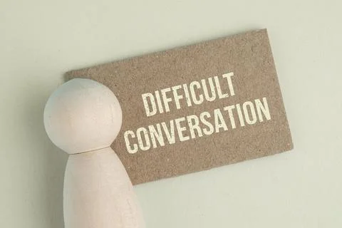 Paper with the word DIFFICULT CONVERSATION on colored background. Difficult.. Stock Photos