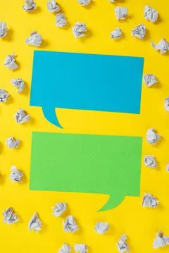 Paper Wraps Placed Around Two Speech Bubbles With Important Informations Stock Photos