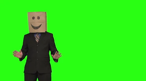 The paperbag man is having a conversation with the audience. green background. Stock Footage 49863363