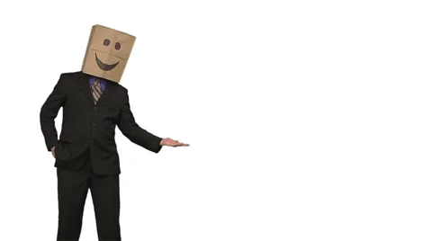 The paperbag man is presenting your text. white background. Stock Footage 49863353
