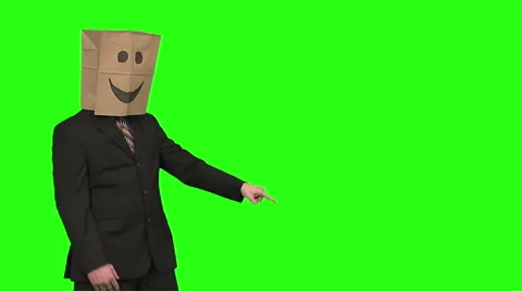 The paperbag man is presenting your text. green background Video stock 49863357