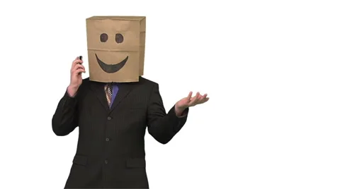 Paperbag man using a cellphone. medium shot. white background Stock Footage 49863324