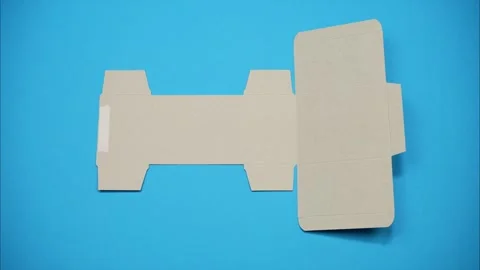 The paperboard template fold step by step along the crease lines. Stop motion 스톡 동영상 339362741