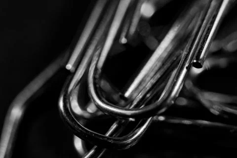 Paperclips on black base Stock Photos