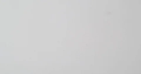 Paperclips drop onto a white surface Stock Footage 117349875