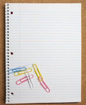 Paperclips on notebook Stock Photos