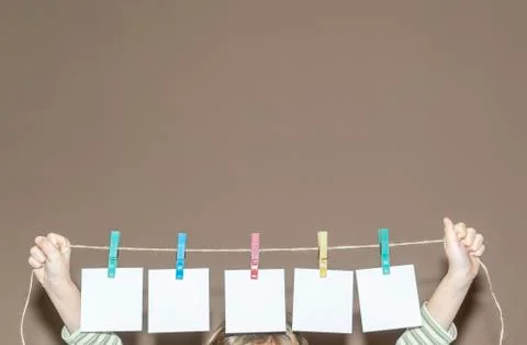 The papers are hung on clips Stock Photos