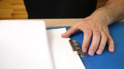 Papers are secured in the folder with a paper clip. Stock Footage 318388972