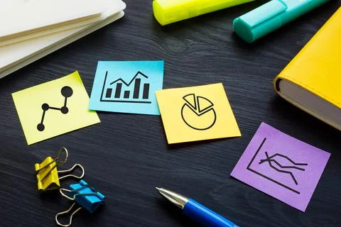 Papers with graphs and business plan or strategy development. Stock Photos