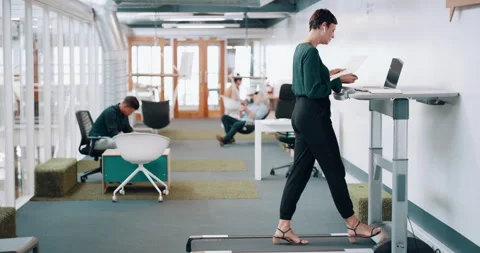 Paperwork, worker or walking on treadmill in office, listening to music in Stock Footage 259279357