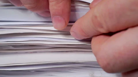 Paperwork.Business concept.Fingers fingering a large stack of paper documents. Stock Footage 143971663