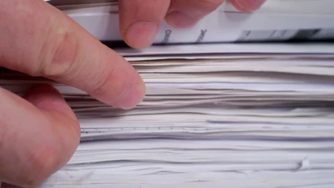Paperwork.Business concept.Fingers fingering a large stack of paper documents. Stock Footage 143971668