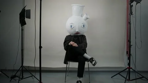 Papier mache head. The bong man talks on camera about the dangers of drugs. Drug Stock Footage 239356145