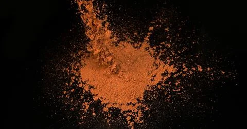 Paprika, capsicum annuum, Powder Exploding against black Background Stock Photos