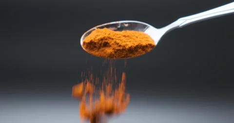 Paprika falling in slow motion from spoon Stock Footage 148949700